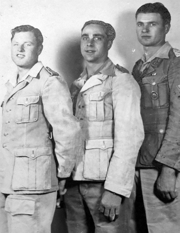 The Cursed Generation. Talking to Wehrmacht Soldiers for the Last Time 5 Black-and-white historical photograph of Josef and two other Wehrmacht soldiers posing in uniform, connected to The Cursed Generation